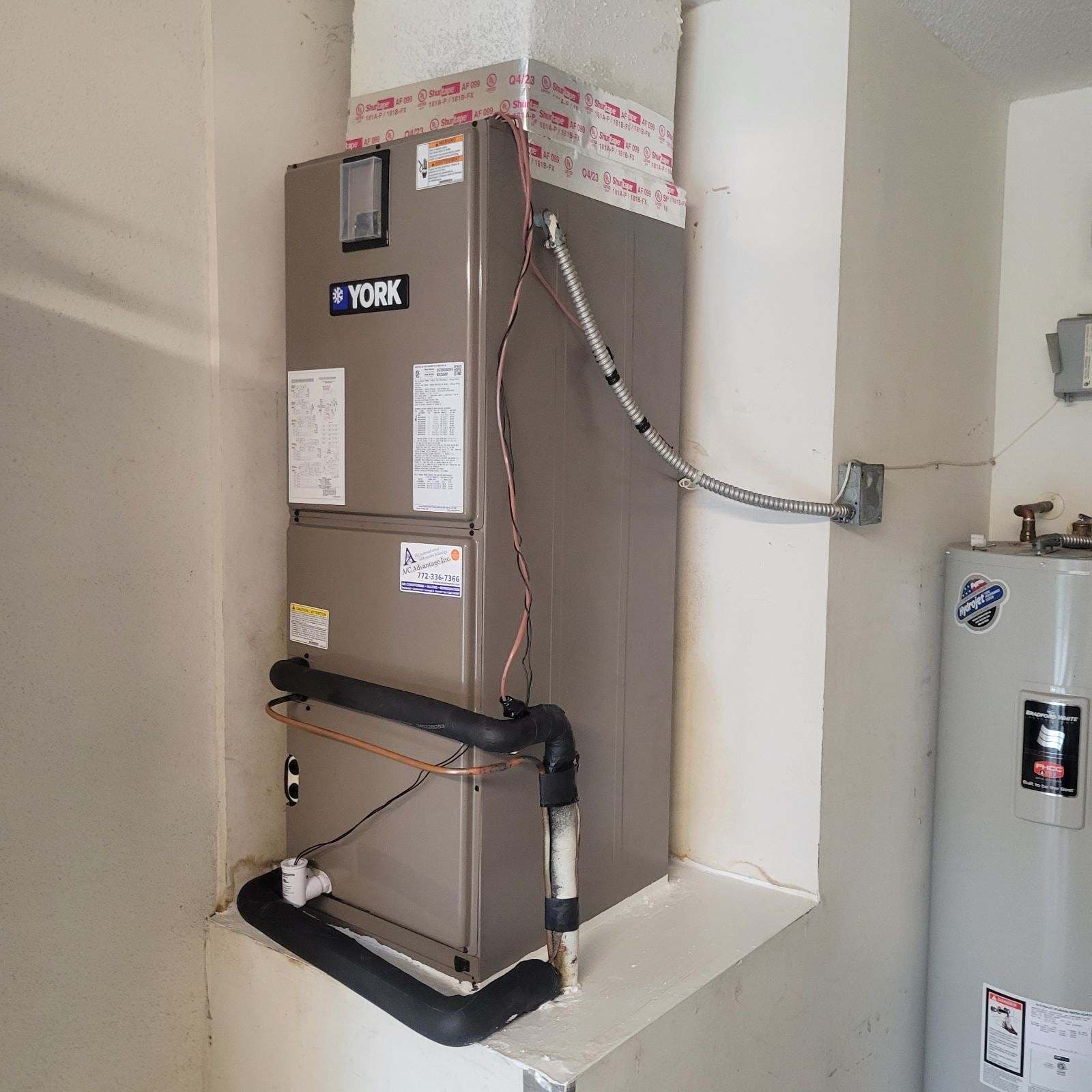 A/C Advantage technician performing air conditioning maintenance